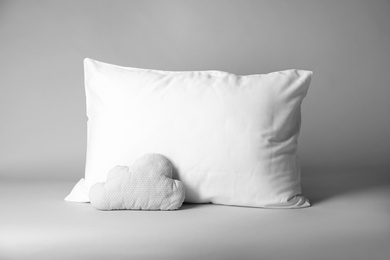 Photo of Blank and decorative pillows on light background