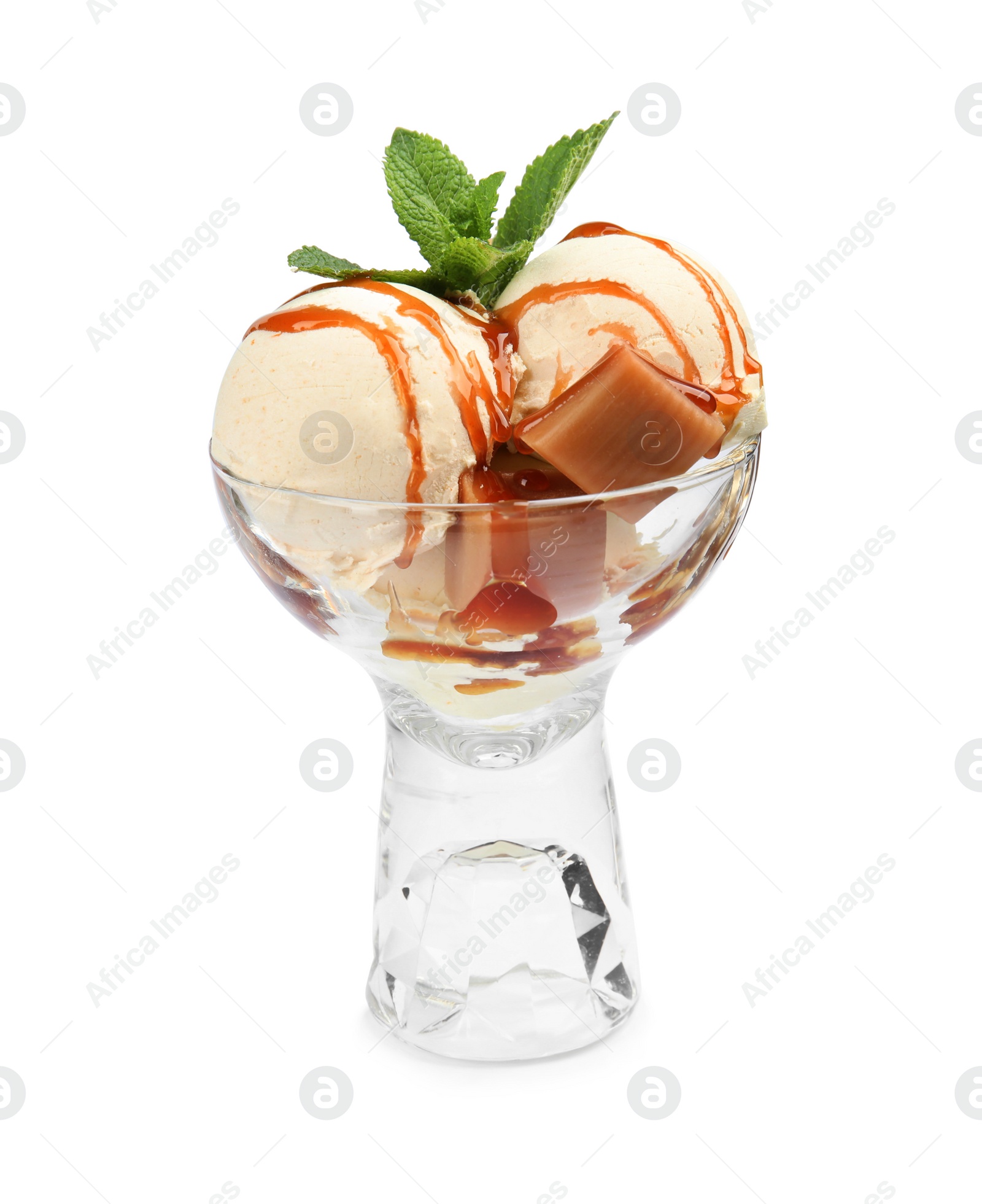 Photo of Delicious ice cream with caramel and mint in glass dessert bowl on white background