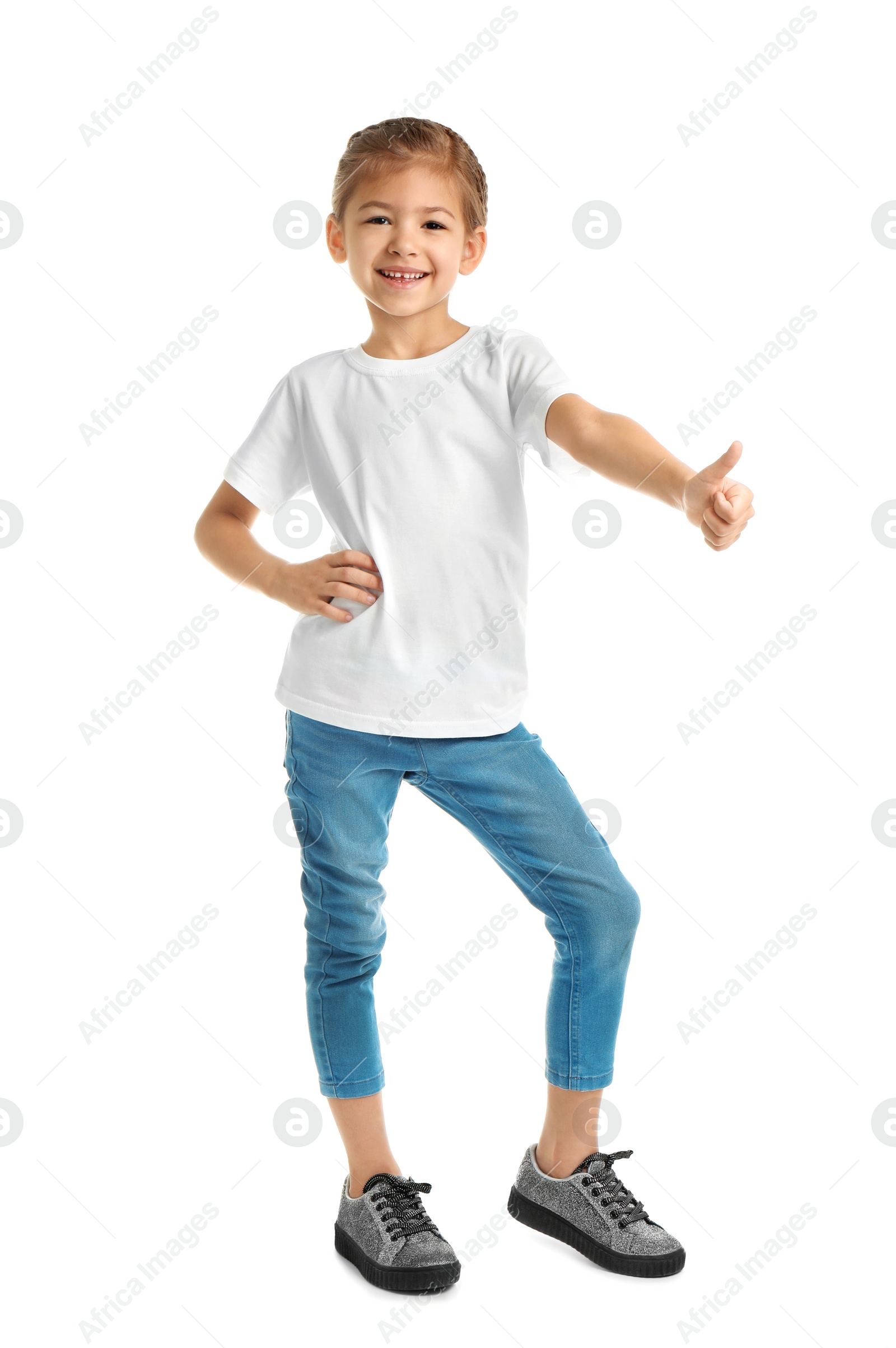 Photo of Little girl in t-shirt on white background. Mockup for design