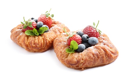 Photo of Fresh delicious puff pastry with sweet berries on white background