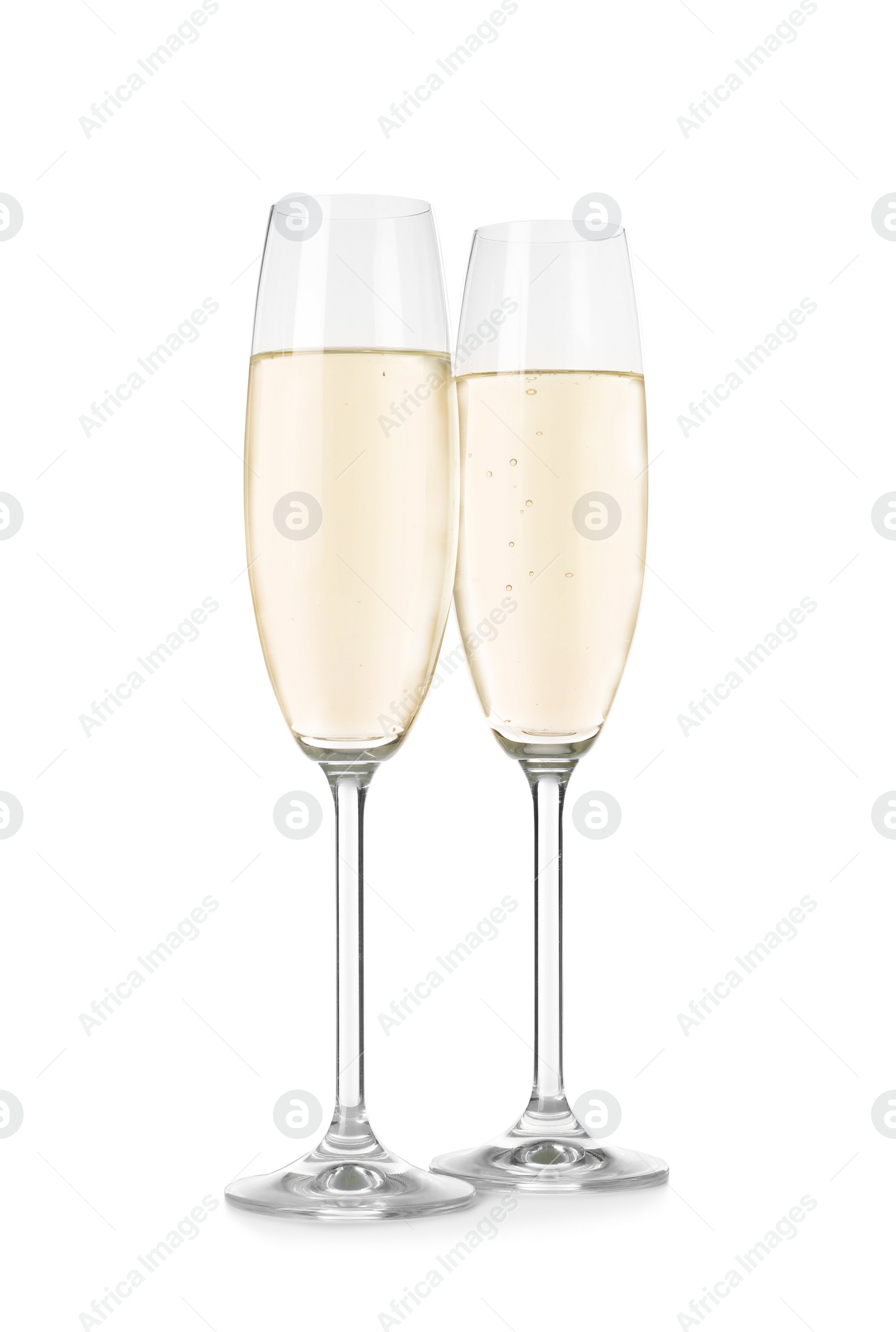 Photo of Glasses of sparkling wine on white background