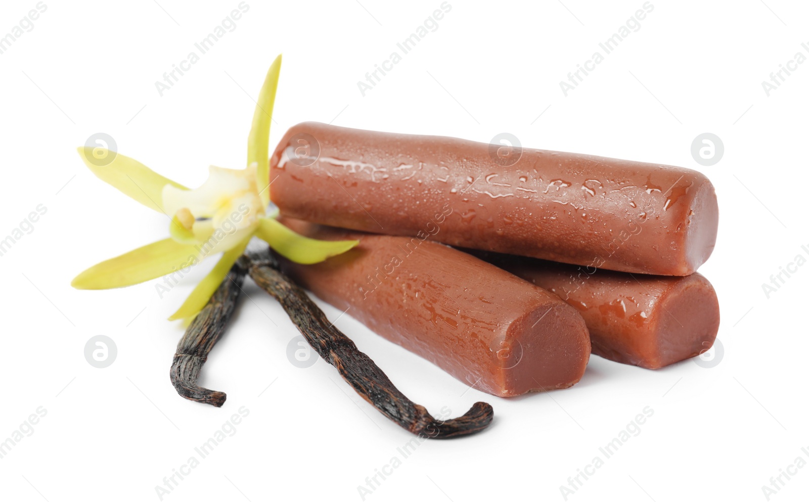 Photo of Glazed curd cheese bars, vanilla pods and flower isolated on white