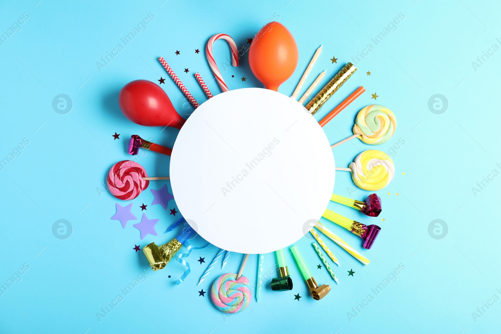 Photo of Different birthday party items and blank card on light blue background, flat lay. Space for text