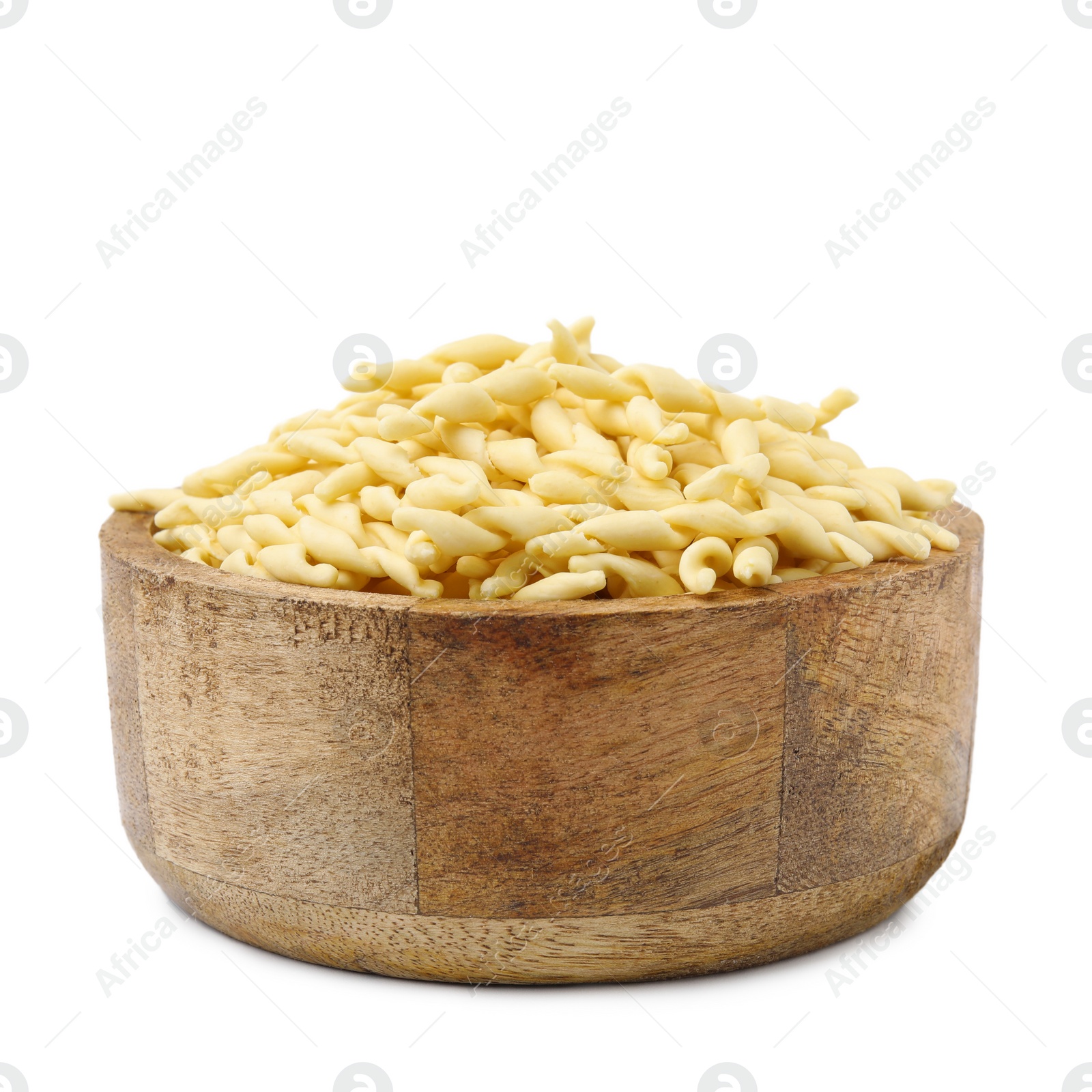 Photo of Uncooked trofie pasta in bowl isolated on white