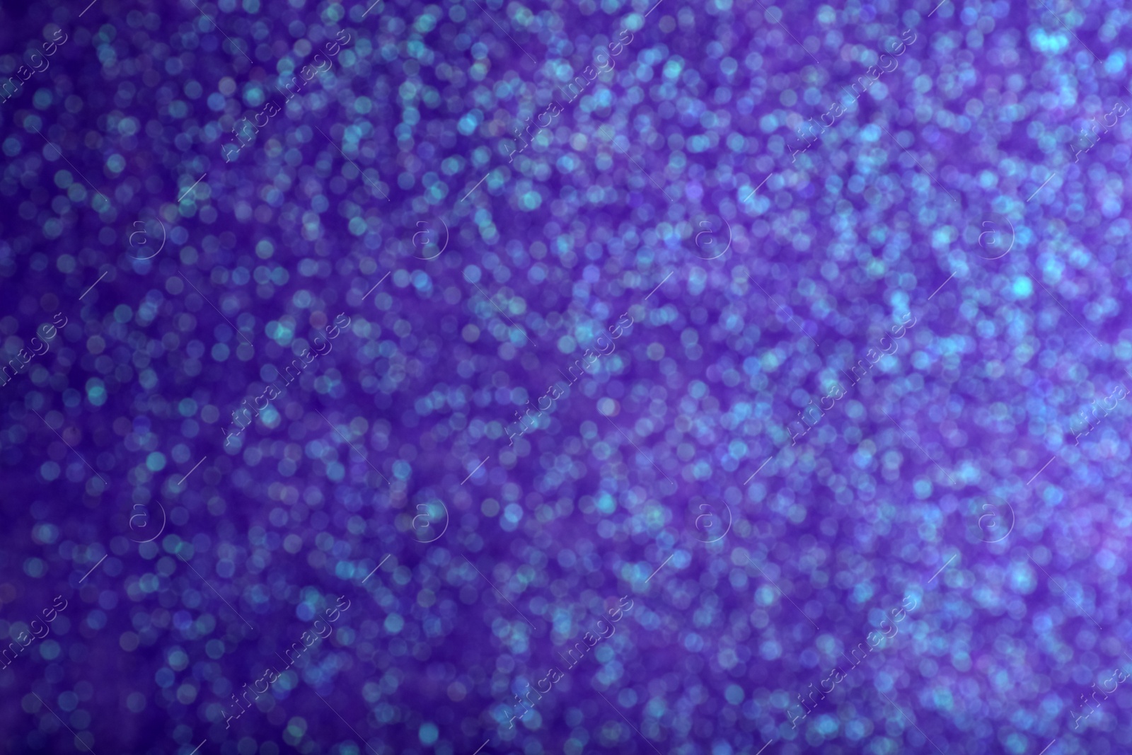 Photo of Shiny purple background with magical bokeh effect