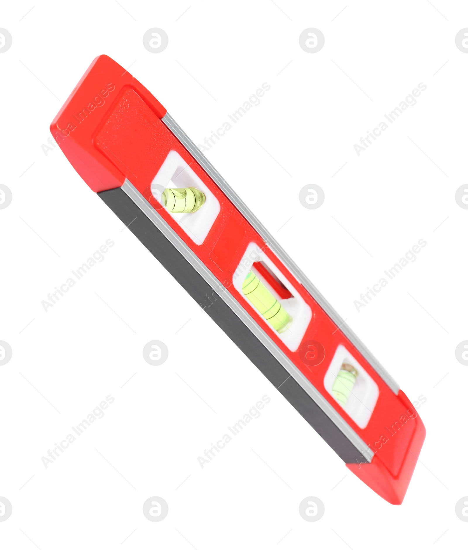 Photo of Red building level isolated on white. Construction tool