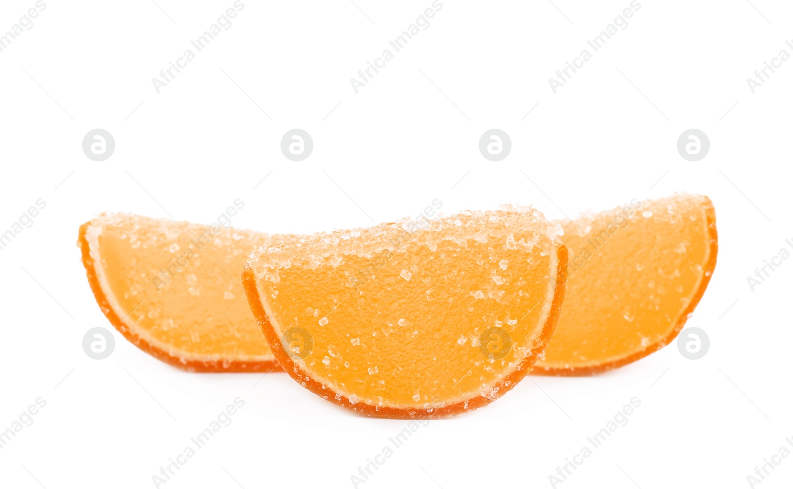 Photo of Sweet orange jelly candies on white background