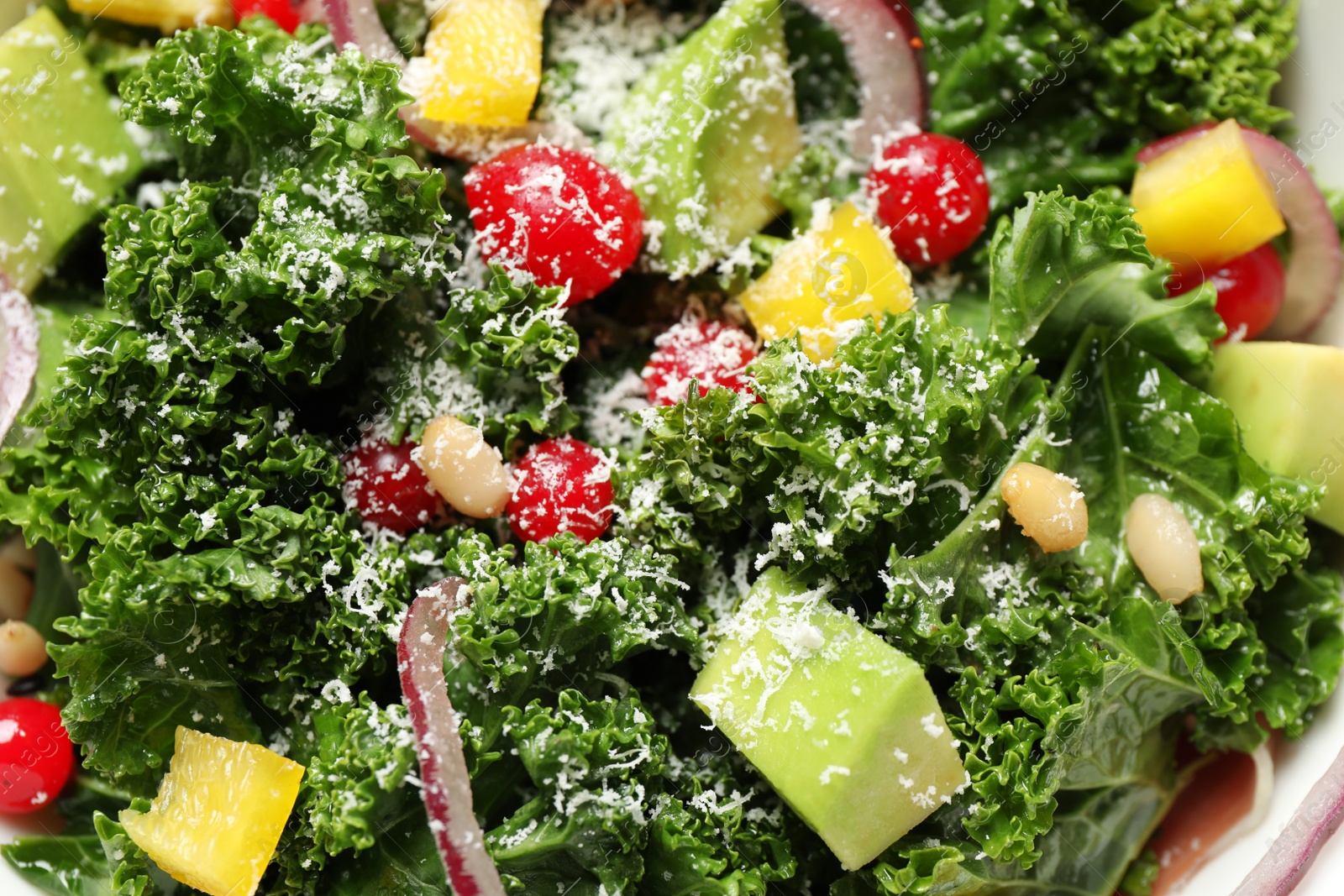 Photo of Tasty fresh kale salad as background, closeup