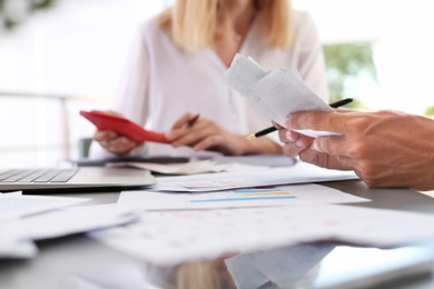 Tax accountants working with documents at table