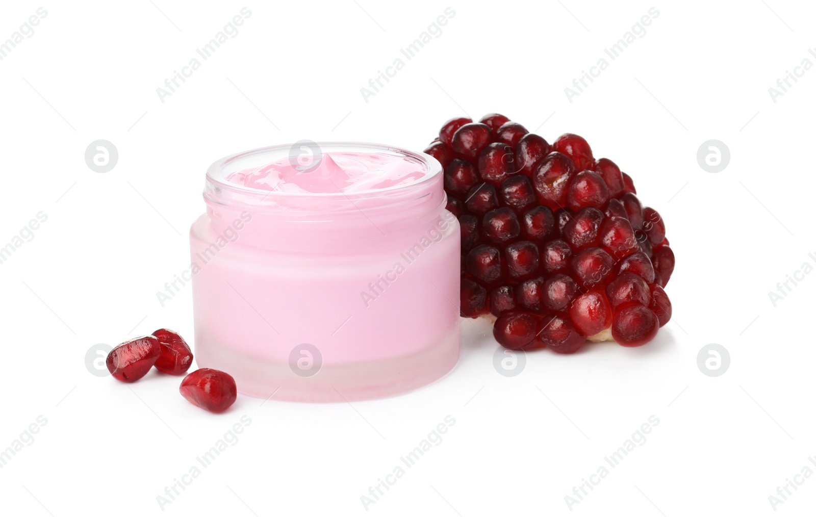 Photo of Glass jar with natural facial mask and pomegranate seeds isolated on white