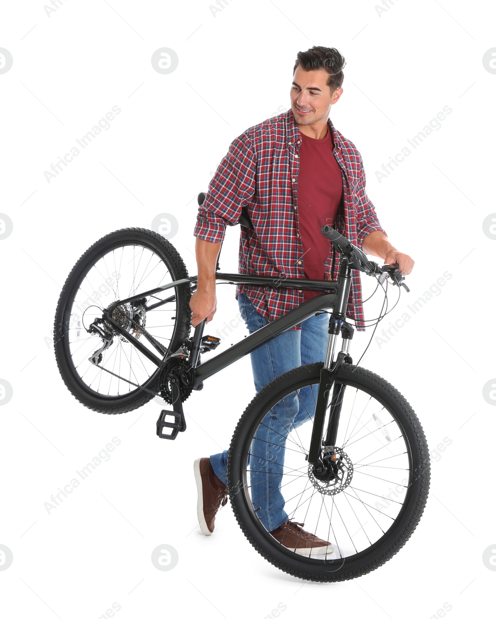 Photo of Handsome young man with modern bicycle on white background