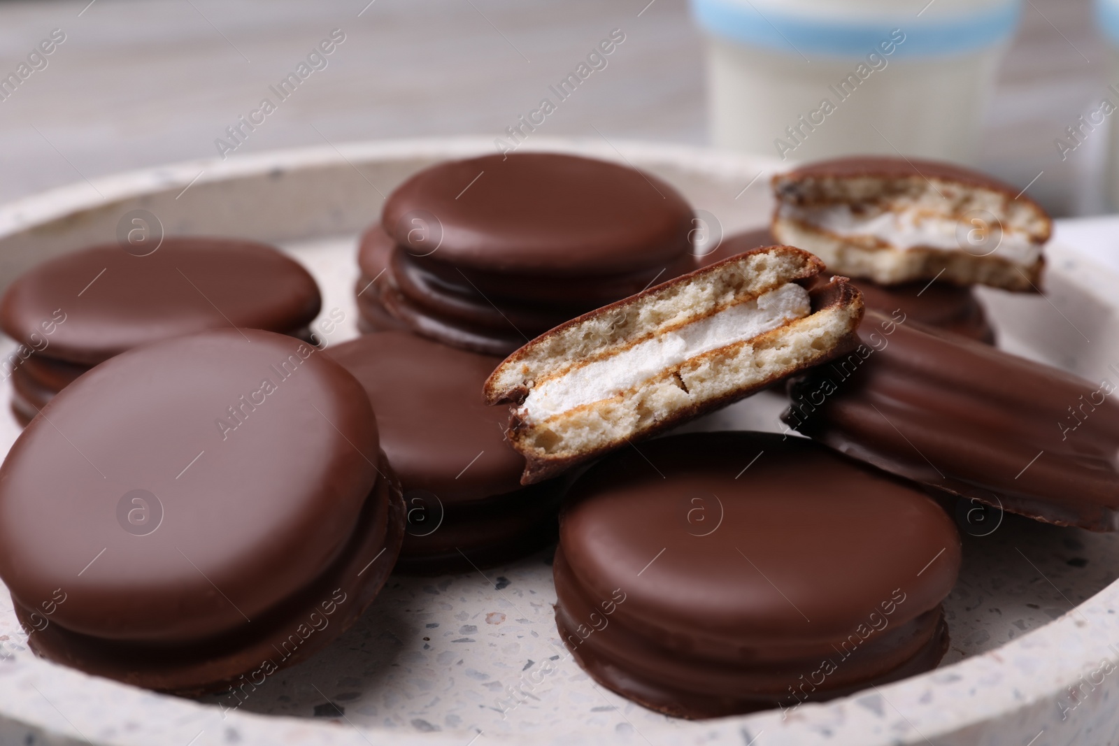 Photo of Tasty choco pies in plate, closeup view