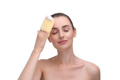 Photo of Young woman washing her face with sponge on white background
