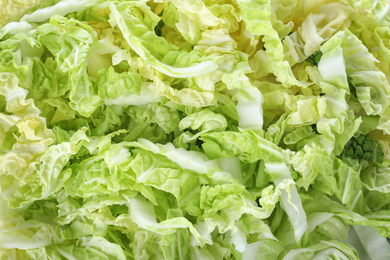 Photo of Fresh chopped Chinese cabbage as background, closeup
