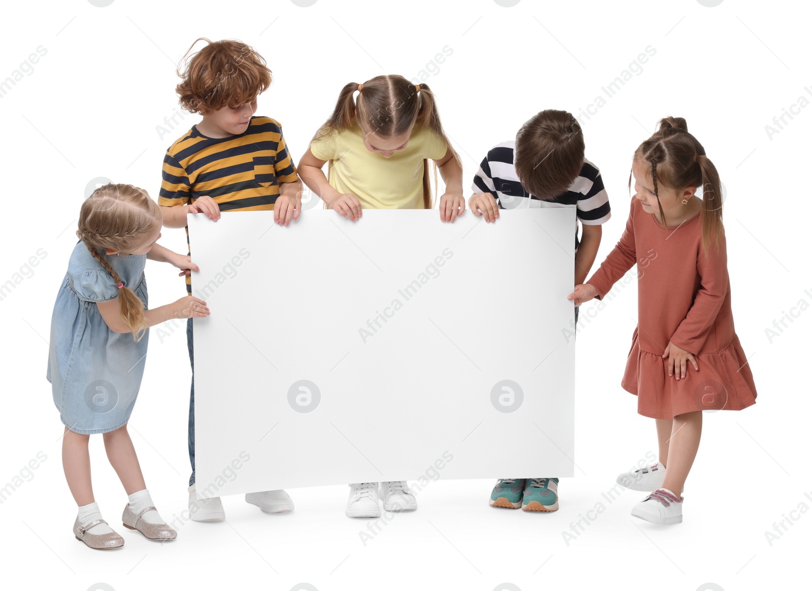 Photo of Group of children with blank poster on white background. Mockup for design