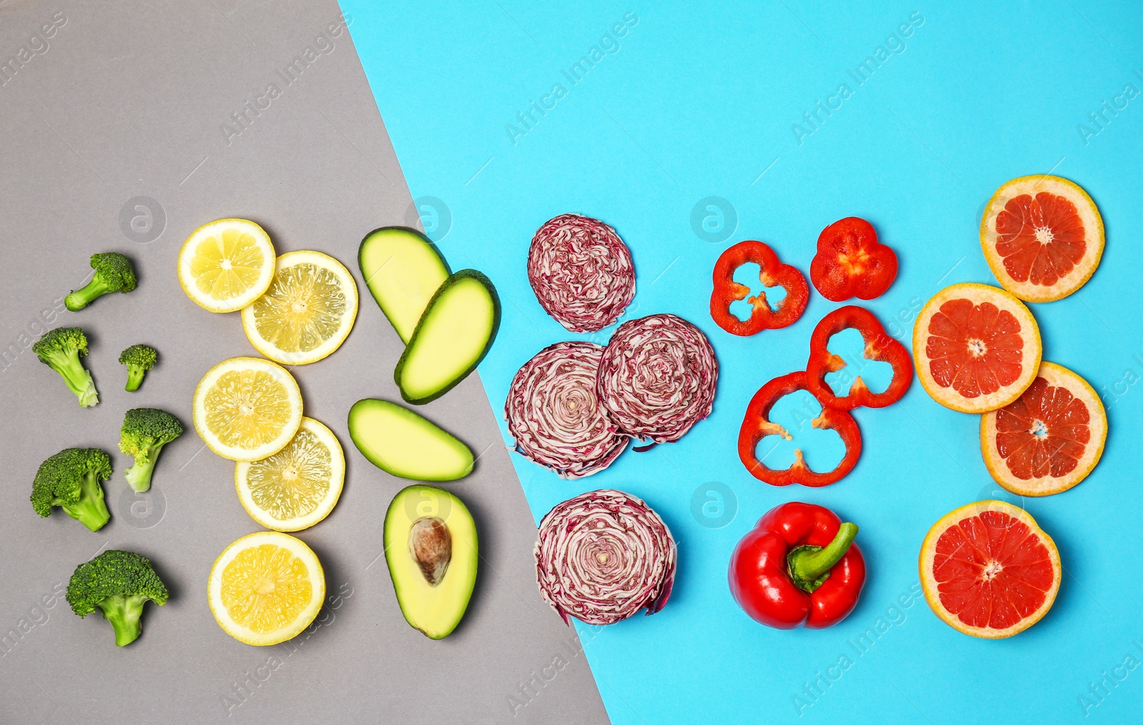 Photo of Rainbow composition with fresh vegetables and fruits on color background, flat lay