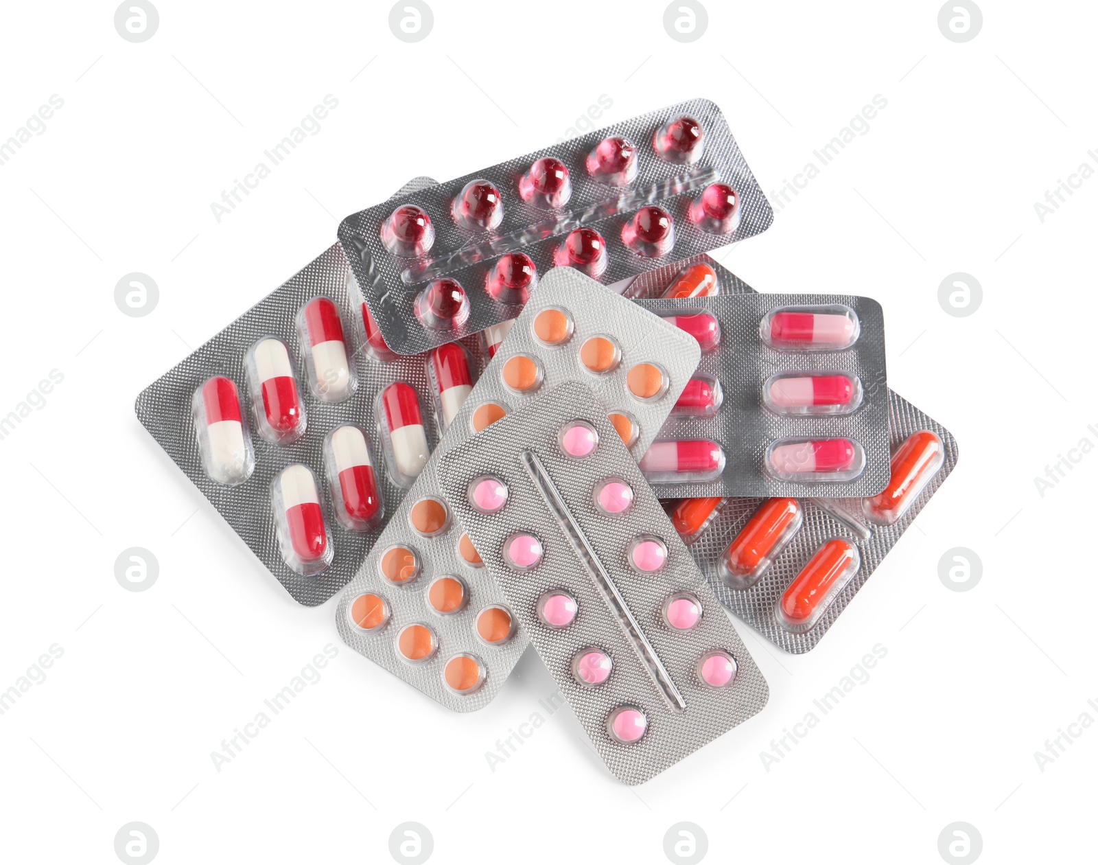 Photo of Blisters with different pills on white background, top view