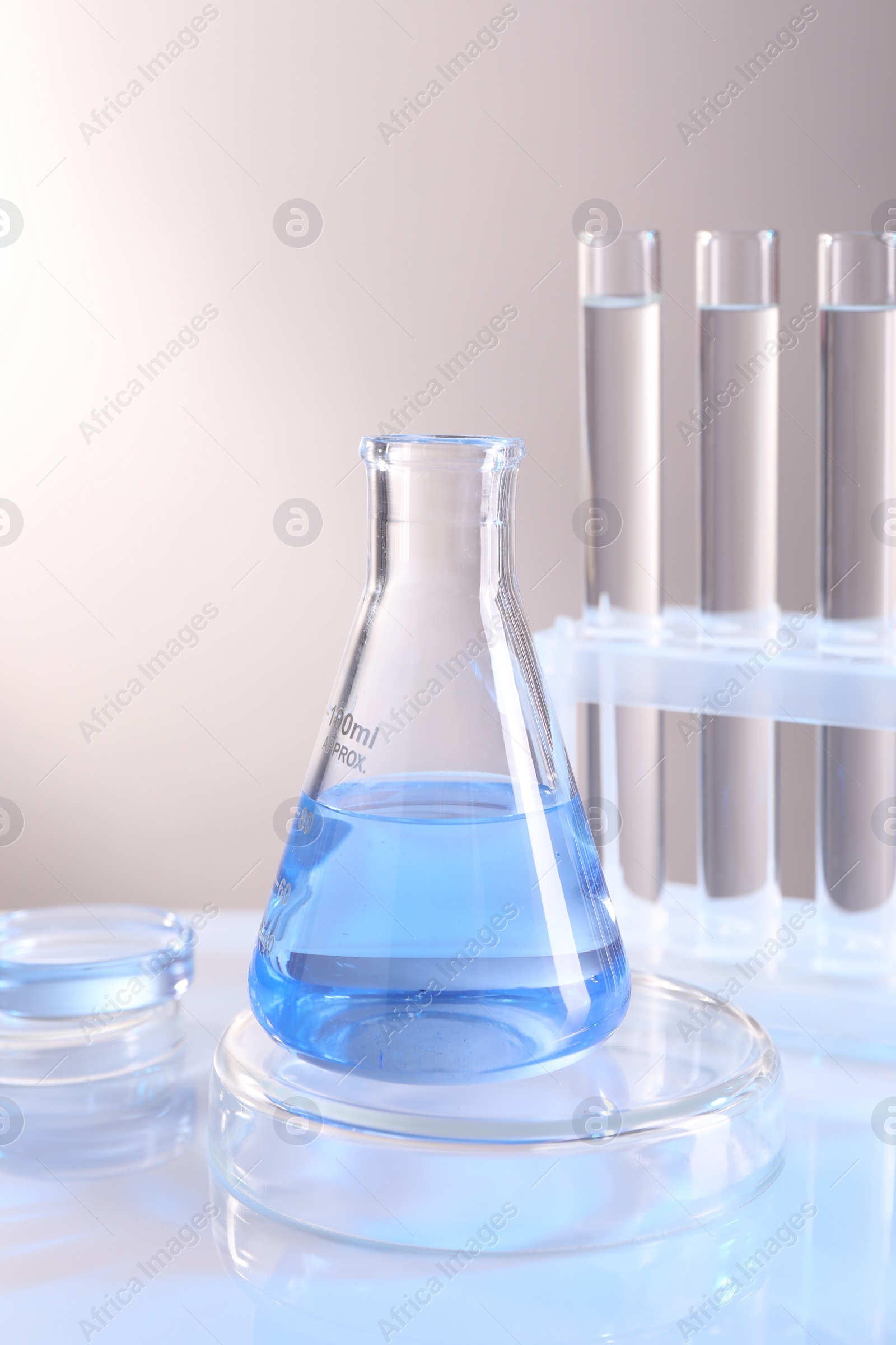 Photo of Laboratory analysis. Different glassware on table against light background