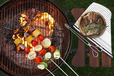 Photo of Cooked food products and grill barbecue outdoors, top view