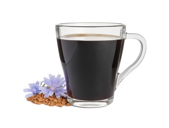 Photo of Glass cup of delicious chicory drink, granules and flowers on white background