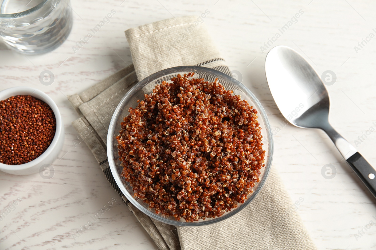 Photo of Cooked red quinoa in bowl on table, top view