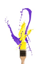 Image of Brush with splashing yellow and violet paints on white background