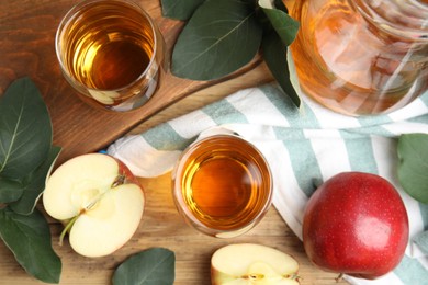 Flat lay composition with delicious apple cider on wooden table