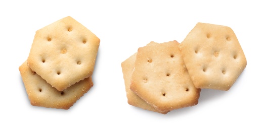 Set of tasty crispy crackers on white background, top view