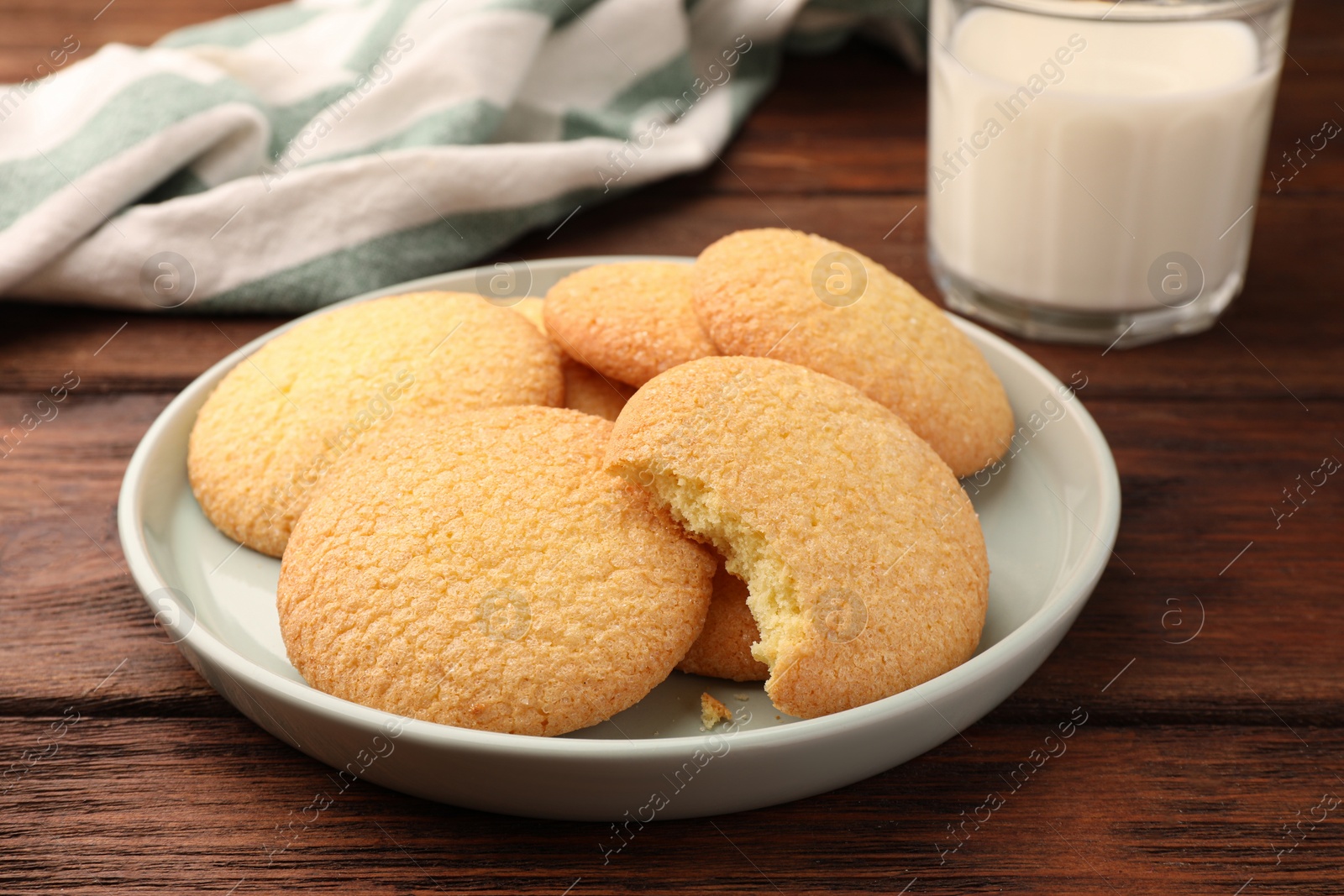 Photo of Delicious Danish butter cookies on wooden table, closeup