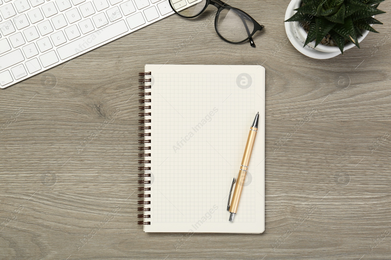 Photo of Flat lay composition with notebook on wooden table