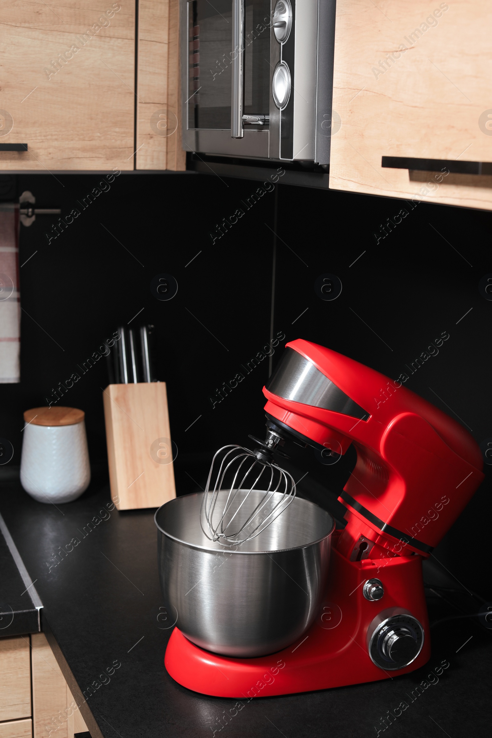 Photo of Modern stand mixer on countertop in kitchen