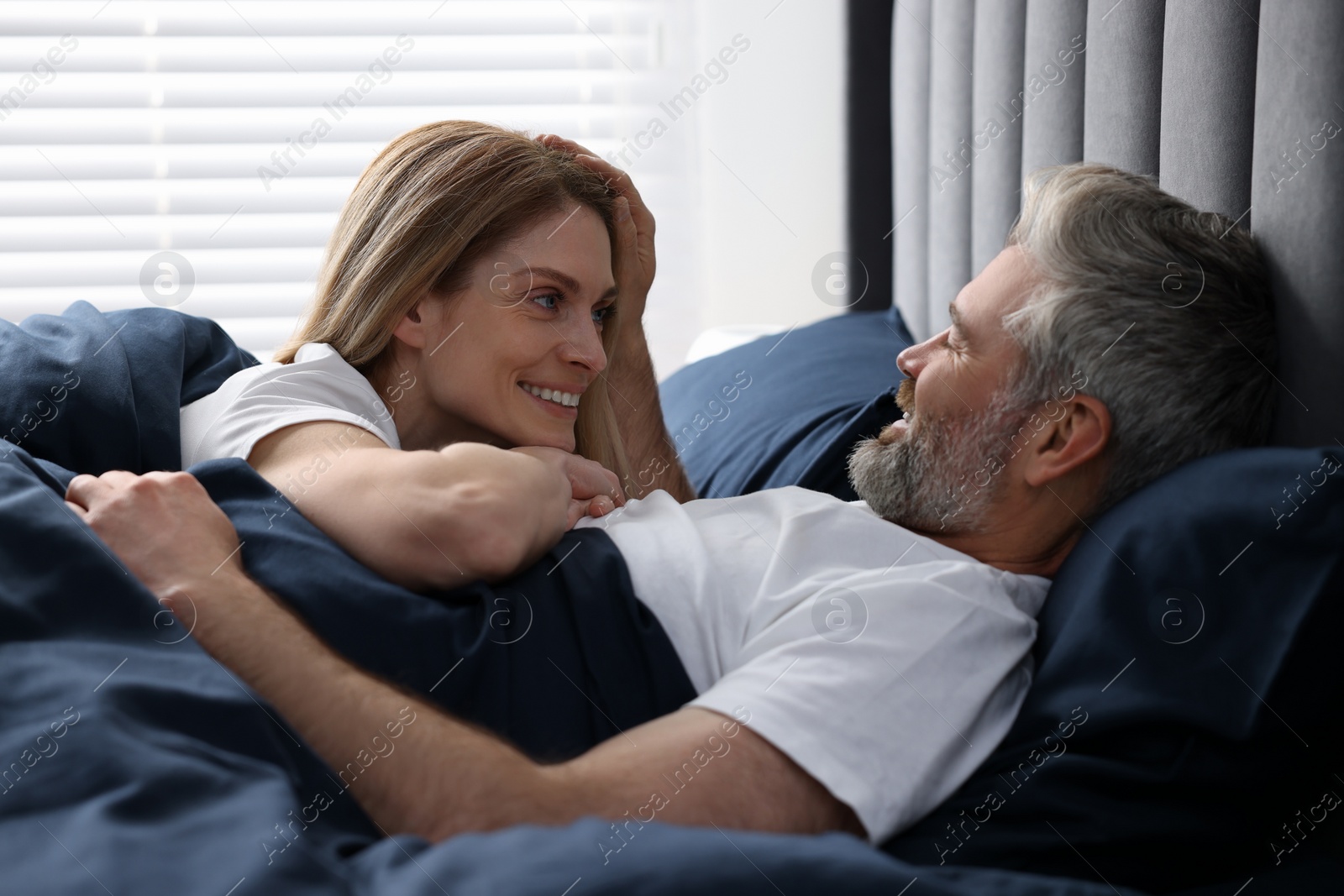 Photo of Lovely mature couple in bed at home