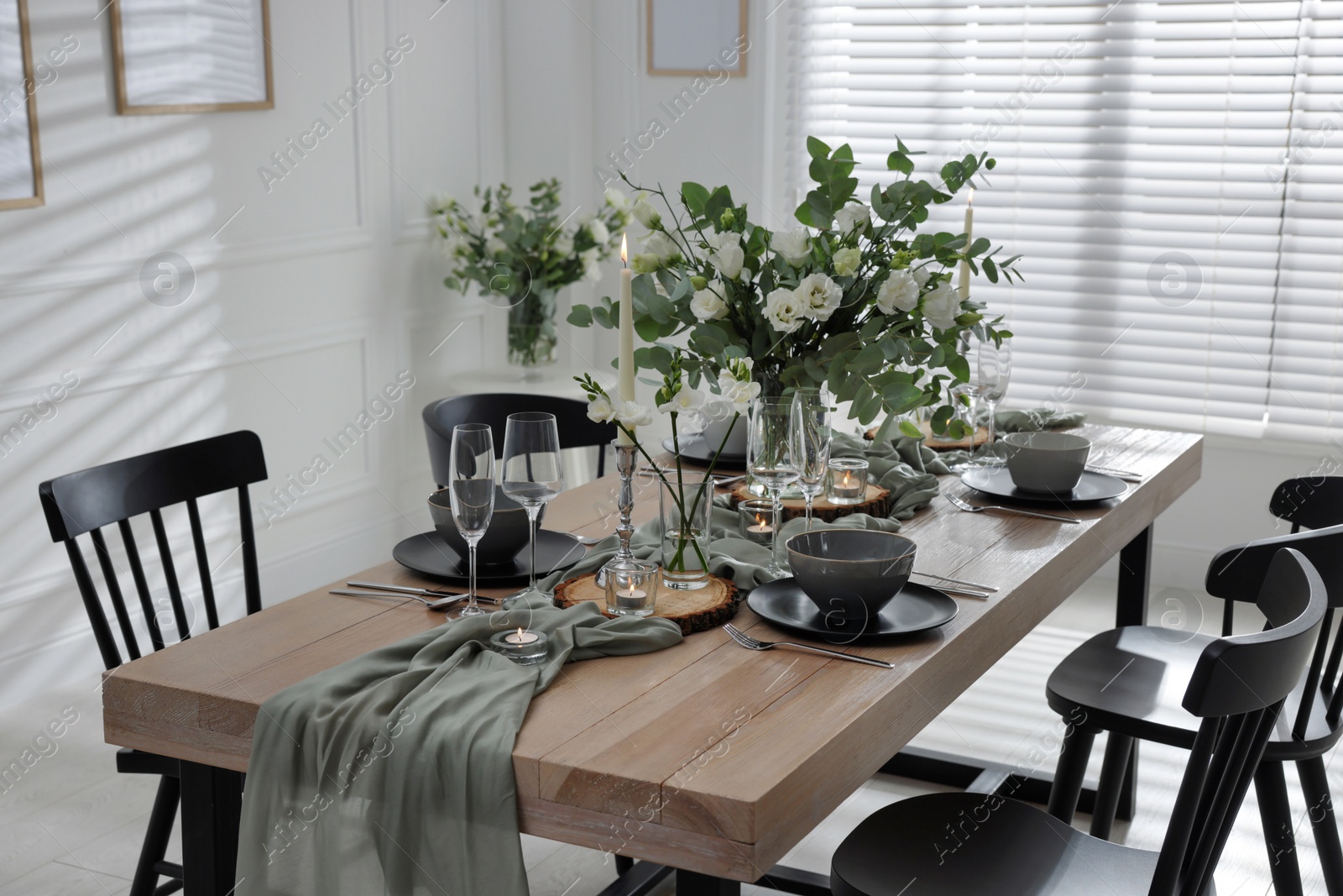 Photo of Festive table setting with beautiful tableware and decor indoors