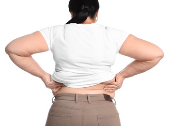 Photo of Overweight woman in tight t-shirt and trousers on white background, closeup. Back view