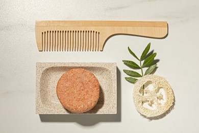 Photo of Flat lay composition with solid shampoo bar on white table