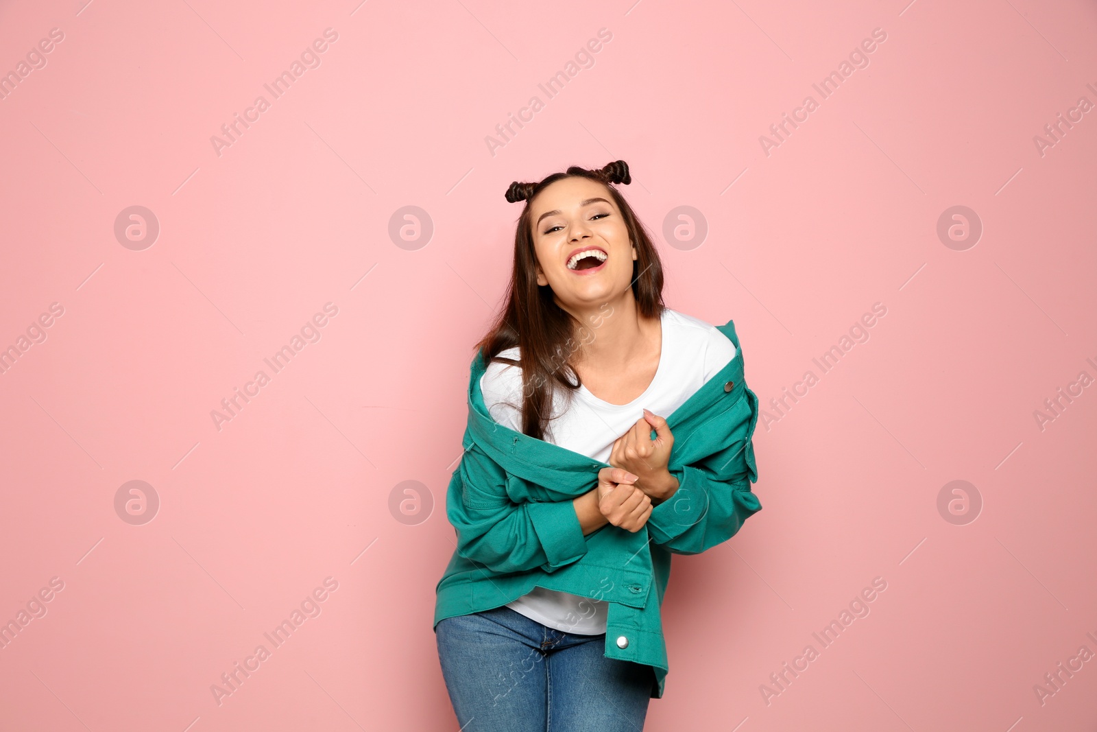 Photo of Portrait of beautiful young woman in stylish clothes on color background