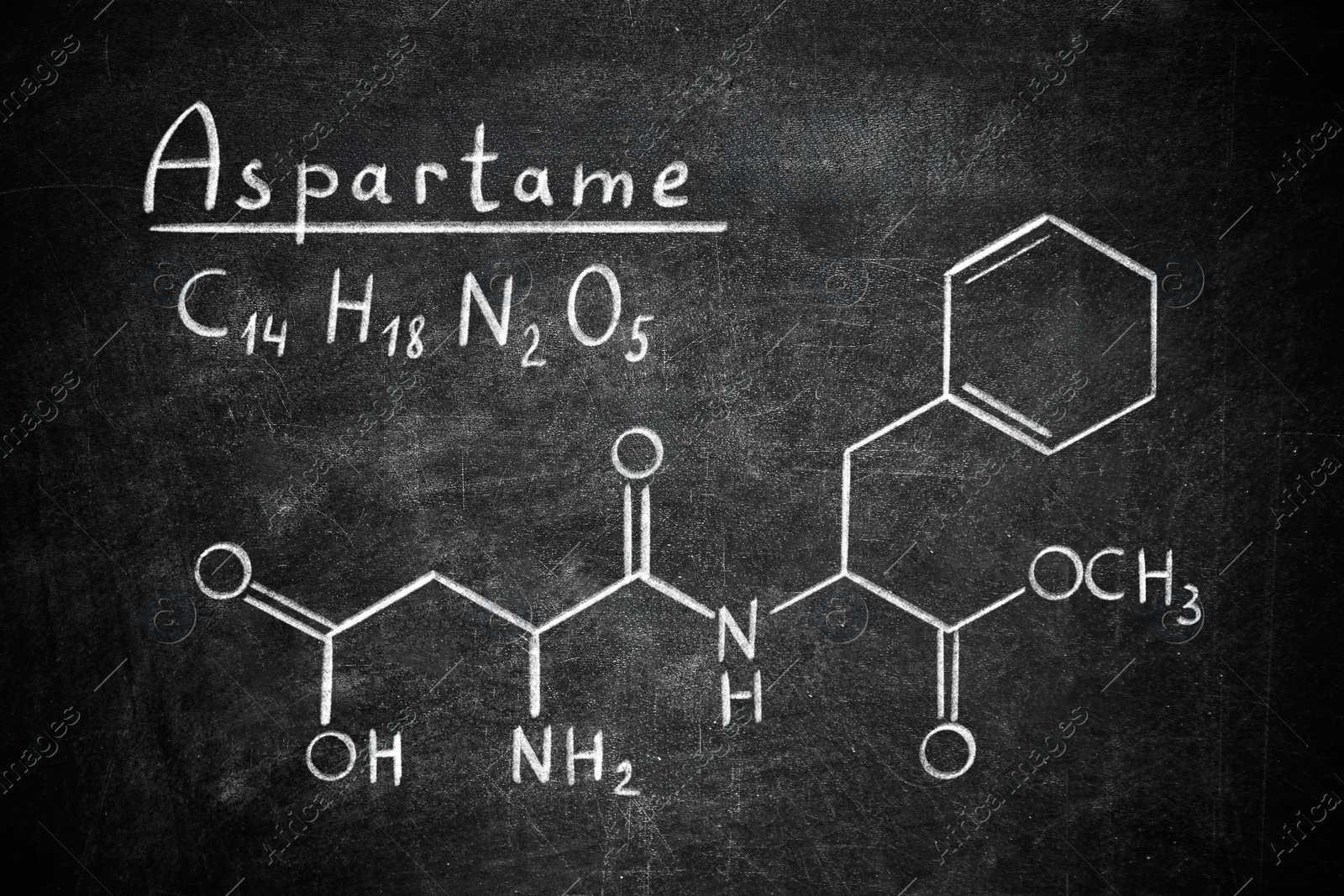 Image of Formula of aspartame (chemical and structural) written on blackboard. Sugar substitute