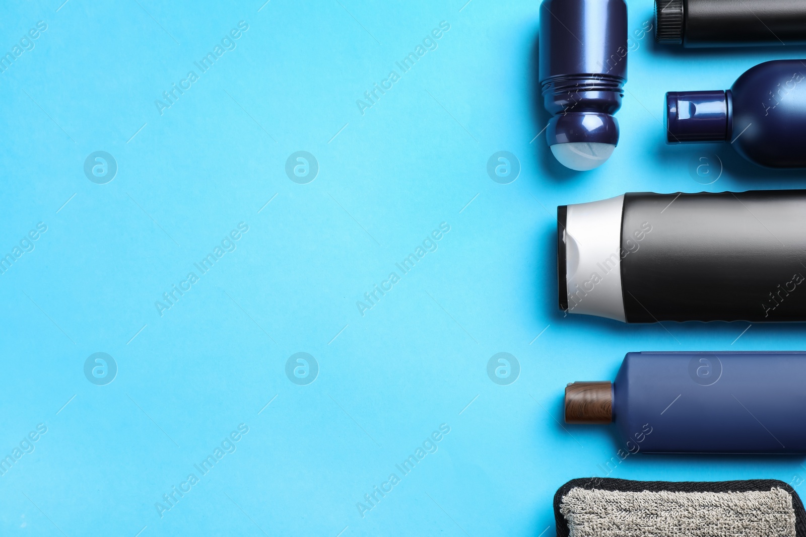 Photo of Flat lay composition with men's cosmetic products on light blue background. Space for text