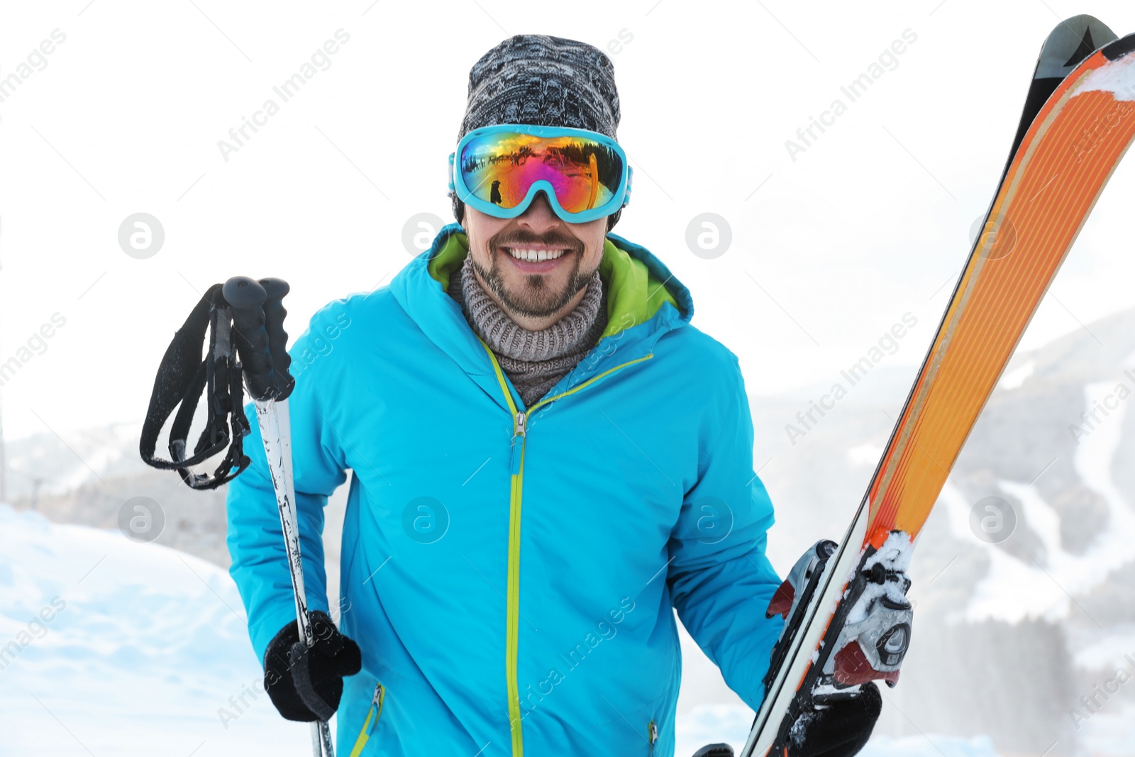 Photo of Man with ski equipment spending winter vacation in mountains