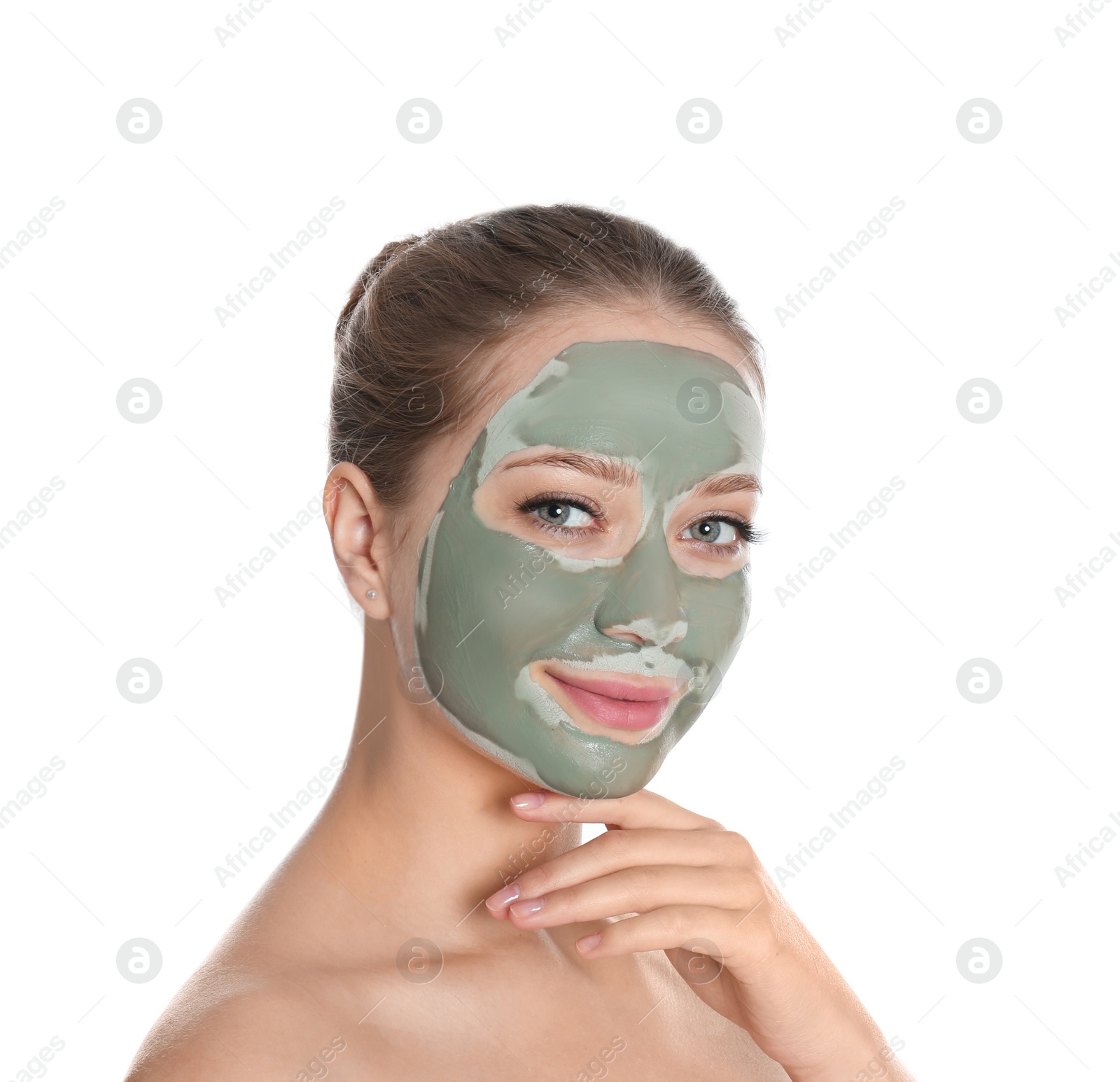 Photo of Beautiful woman with clay mask on her face against white background