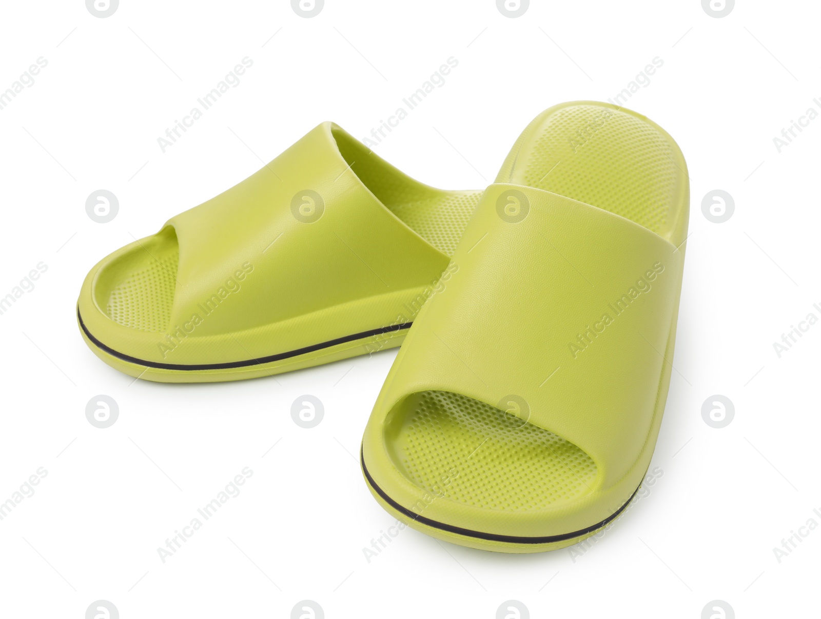 Photo of Pair of green rubber slippers isolated on white
