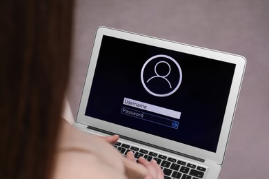 Photo of Woman unlocking laptop with blocked screen indoors, closeup