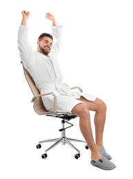 Handsome man wearing bathrobe on white background