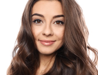 Beautiful woman with shiny wavy hair on white background