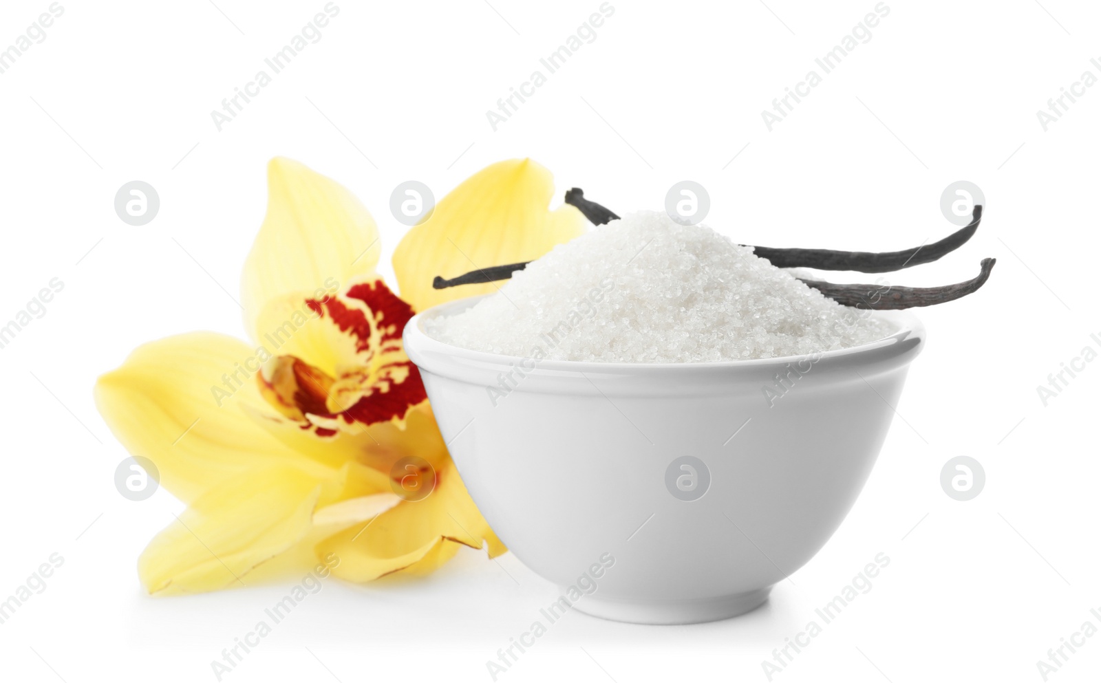 Photo of Vanilla sugar in bowl with flower and sticks on white background