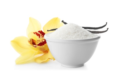 Photo of Vanilla sugar in bowl with flower and sticks on white background