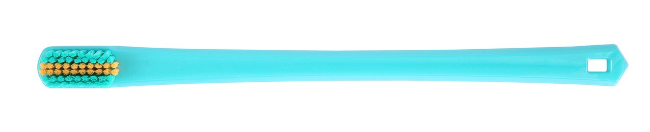 Photo of Turquoise plastic toothbrush isolated on white, top view