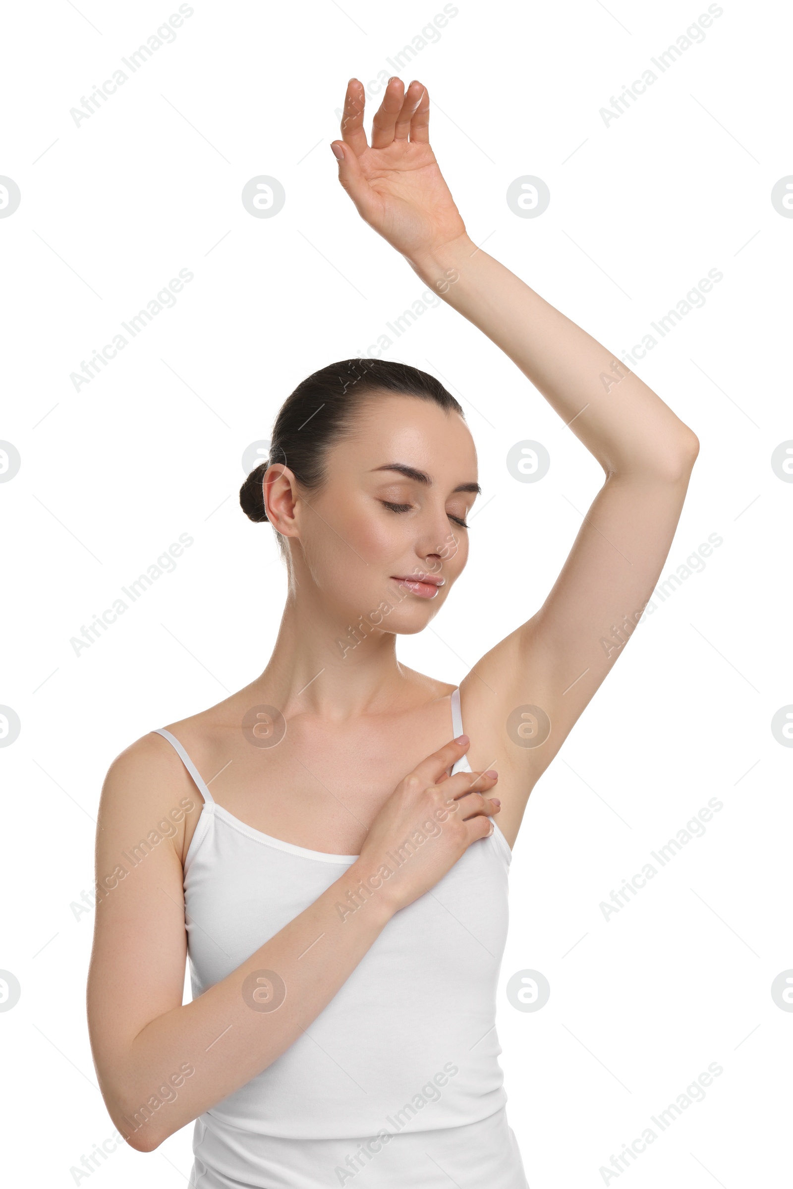 Photo of Beautiful woman showing armpit with smooth clean skin on white background