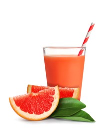 Glass of grapefruit juice, fresh fruit and green leaves on white background