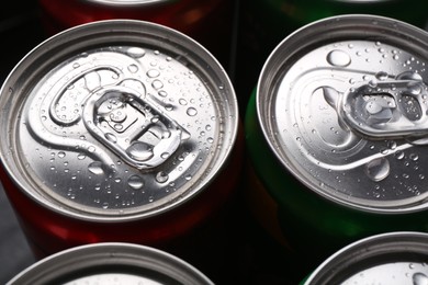 Energy drink in wet cans, closeup. Functional beverage